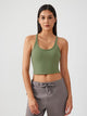 Athletic woman wearing a breathable workout tank top during yoga session