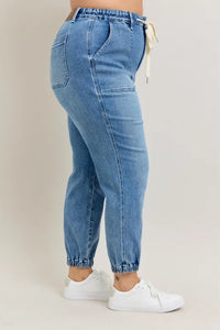Judy Blue High Waist Denim Jogger in blue wash on model