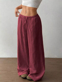 Women's plus size cotton drawstring wide leg pants in Wine Red, showing relaxed fit and tie waist.