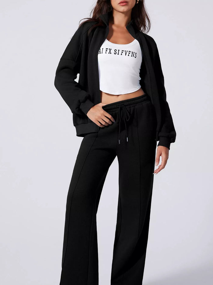 Women's Zip Up Jogger Set in Black on model showing pockets
