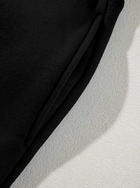 Women's Zip Up Jogger Set in Black on model showing pockets