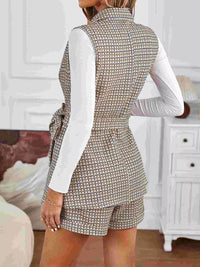Back view of women's tailored houndstooth shorts and vest outfit