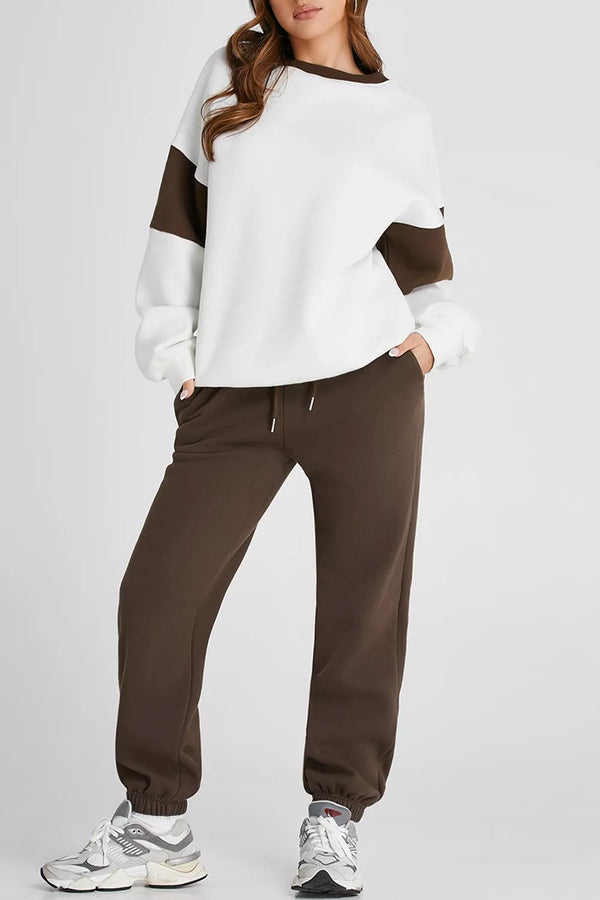 Women's Oversized Loungewear Set in White, featuring a drop-shoulder sweatshirt and matching joggers on a model.