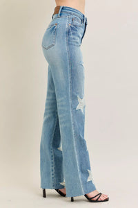 Judy Blue 90s Straight Jeans in a distressed wash, modeled from the front, showing the high waist and straight leg fit.