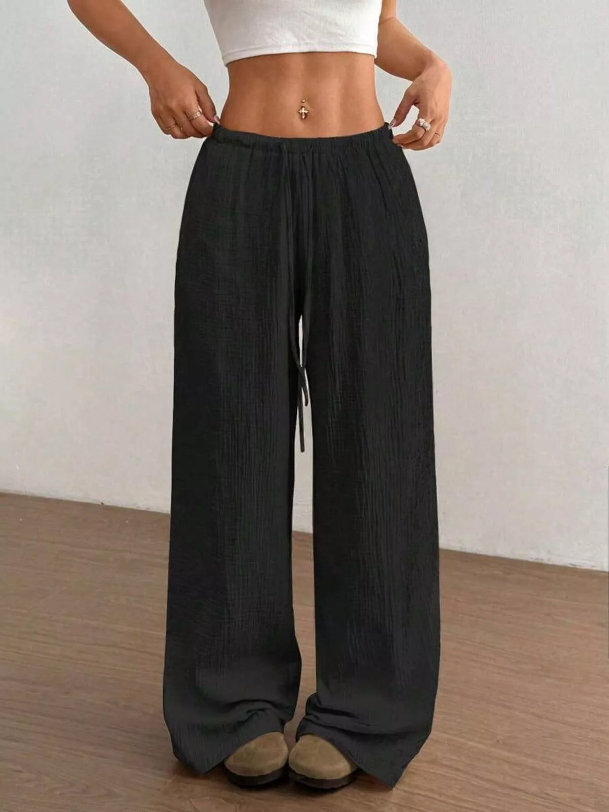Women's plus size cotton drawstring wide leg pants in Black, showing relaxed fit and tie waist.