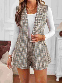 Model wearing belted houndstooth blazer vest and shorts set