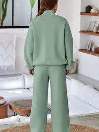 Women's Zip Up Jogger Set in Sage on model showing pockets