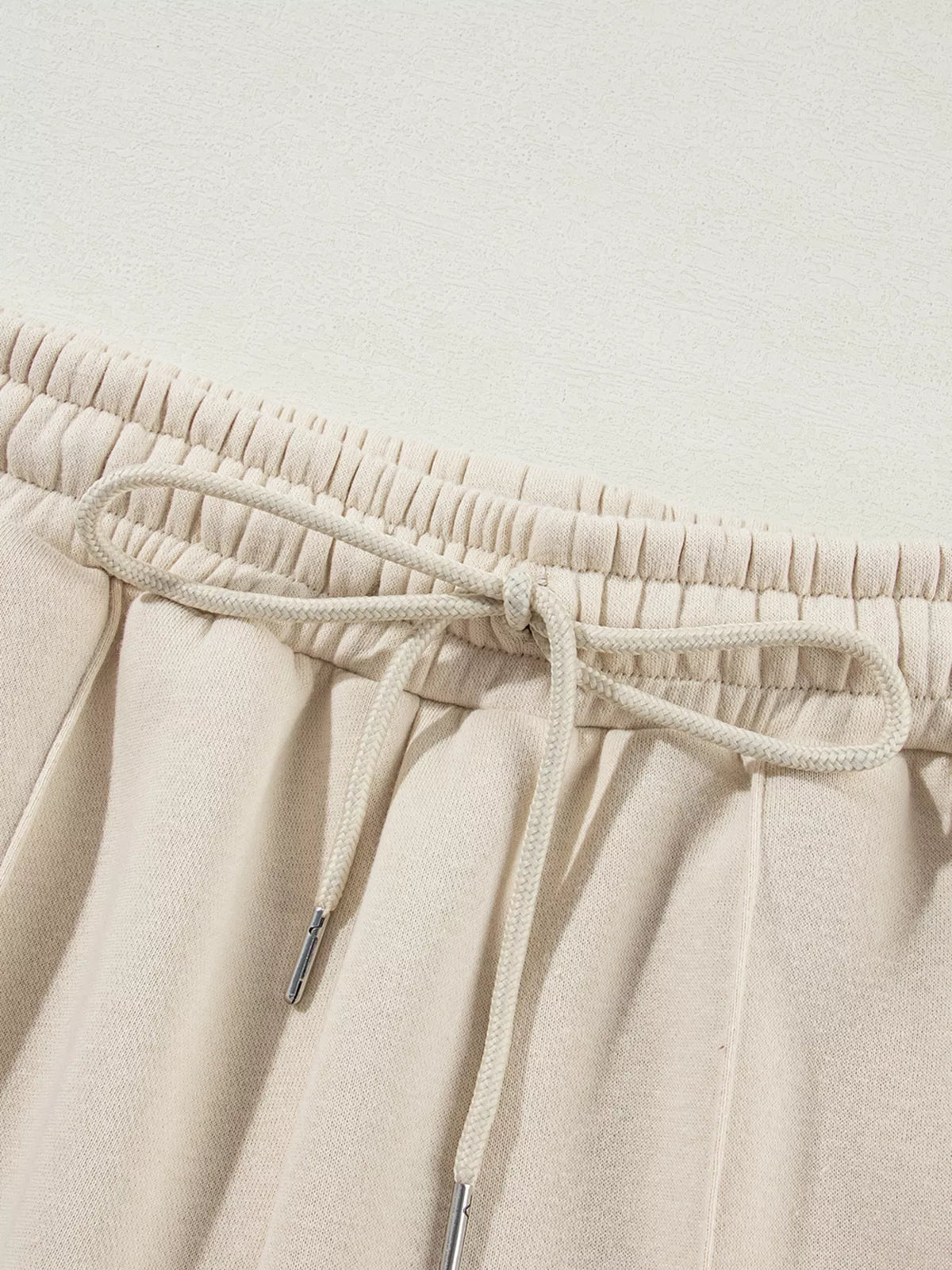 Women's Zip Up Jogger Set in Beige on model showing pockets