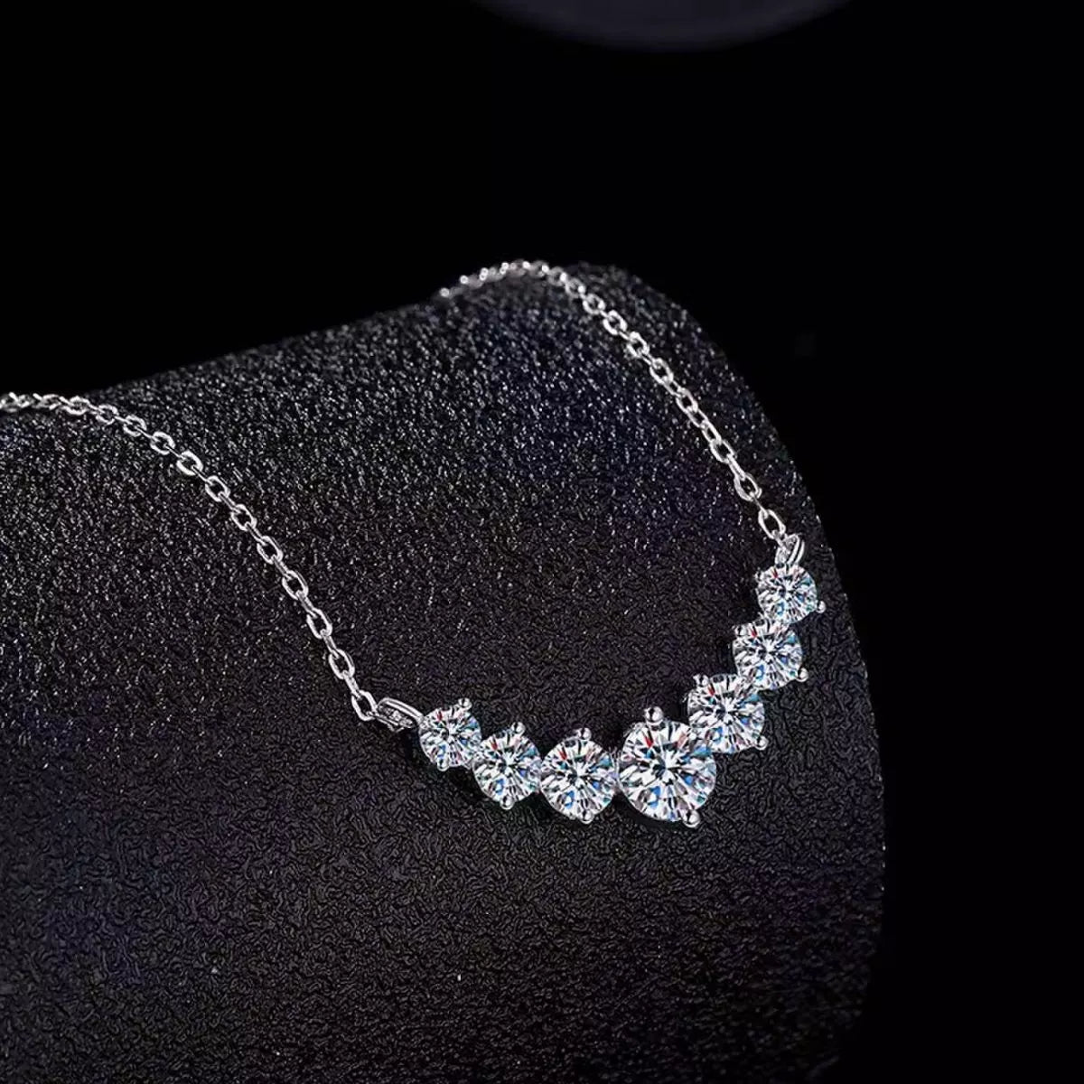 1.7ct moissanite solitaire necklace featuring sparkling stones on a delicate silver chain display.