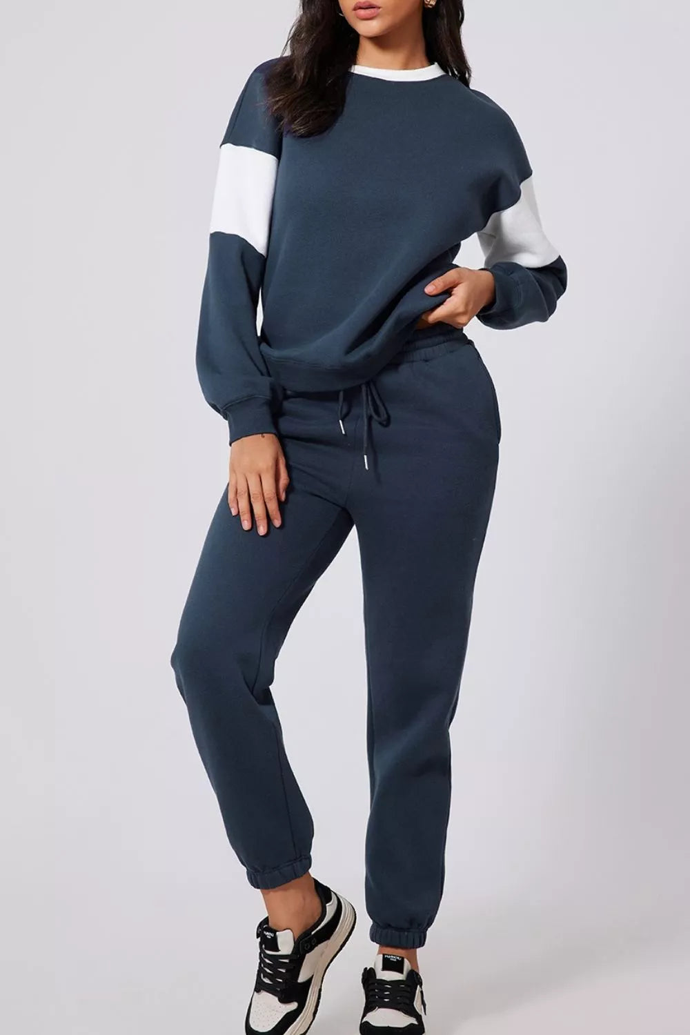 Women's Oversized Loungewear Set in Navy, featuring a drop-shoulder sweatshirt and matching joggers on a model.