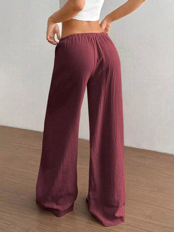 Women's plus size cotton drawstring wide leg pants in Wine Red, showing relaxed fit and tie waist.
