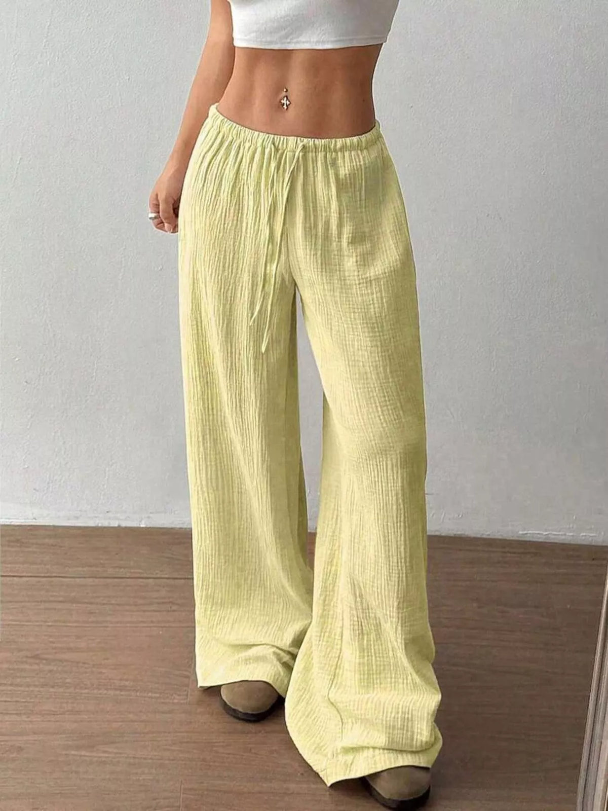 Women's plus size cotton drawstring wide leg pants, showing relaxed fit and tie waist.