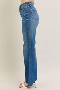 High Waist Tummy Control Jeans with Destroyed Hem on a plus-size model.
