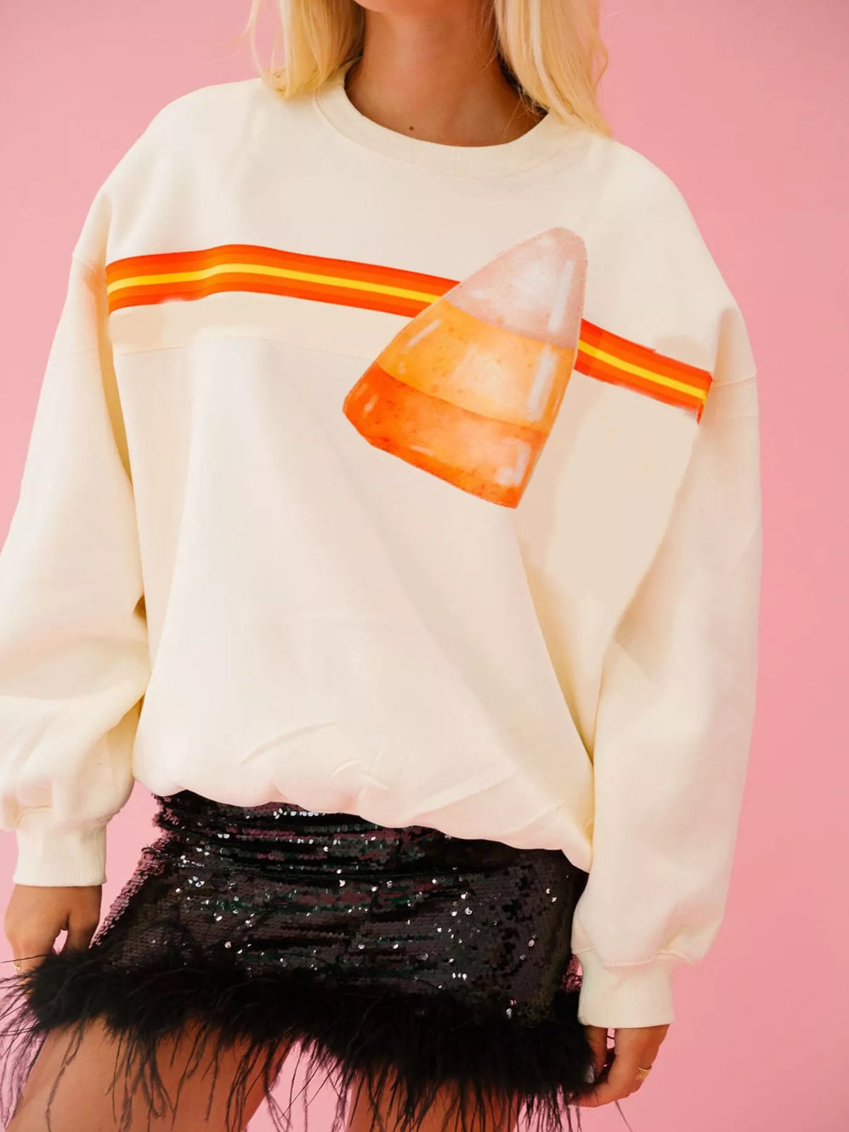 Spooky Halloween Sequin Sweatshirt showing the reversible design from black with orange sequins to orange with black sequins.