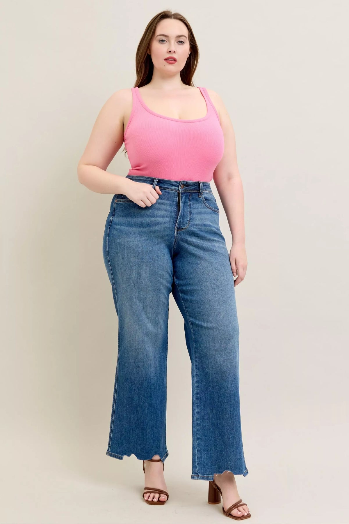 High Waist Tummy Control Jeans with Destroyed Hem on a plus-size model.