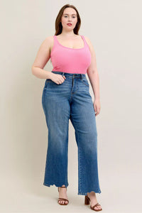 High Waist Tummy Control Jeans with Destroyed Hem on a plus-size model.