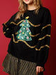 Sparkle Christmas Tree Sweatshirt on a model against a festive background.