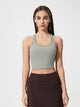 Athletic woman wearing a breathable workout tank top during yoga session