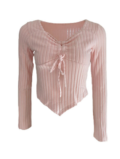 Women’s ruched drawstring ribbed long sleeve top in beige, styled with jeans for casual fall outfit