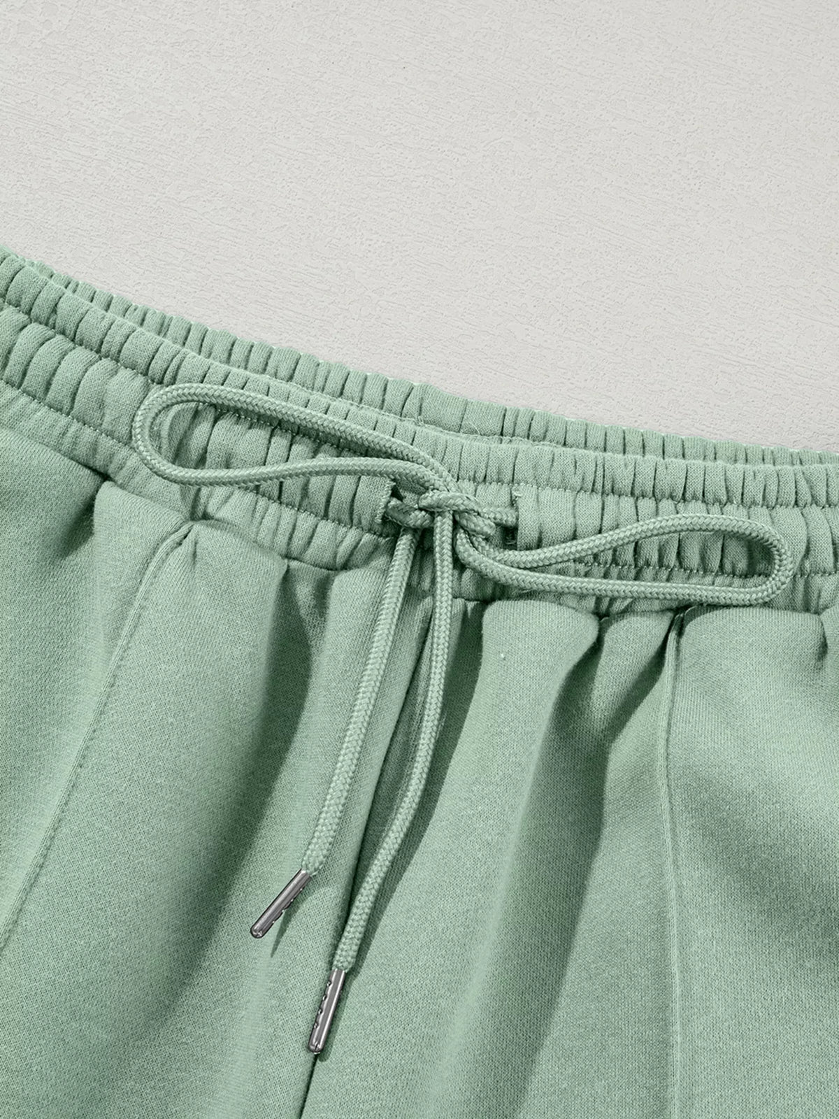 Women's Zip Up Jogger Set in Sage on model showing pockets