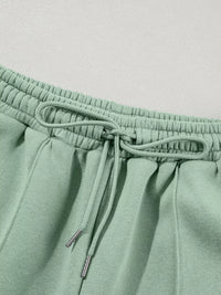Women's Zip Up Jogger Set in Sage on model showing pockets