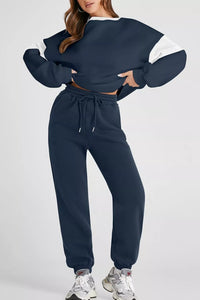 Women's Oversized Loungewear Set in Navy, featuring a drop-shoulder sweatshirt and matching joggers on a model.