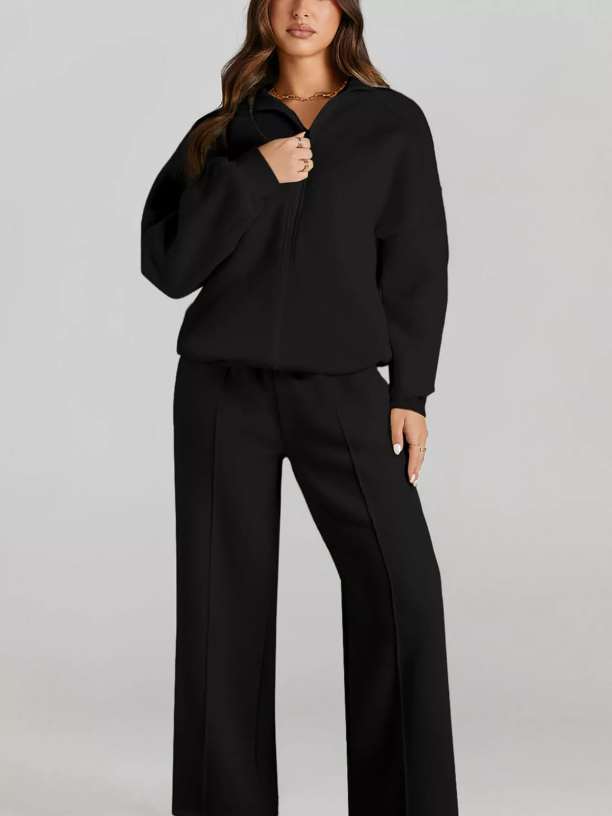 Women's Zip Up Jogger Set in Black on model showing pockets