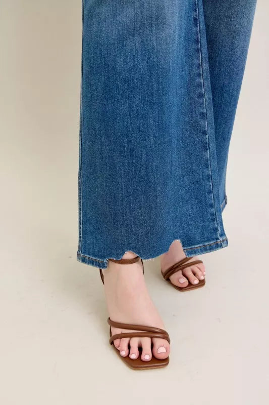 High Waist Tummy Control Jeans with Destroyed Hem on a plus-size model.