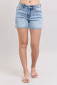 Judy Blue Denim Shorts in mid rise washed style on model