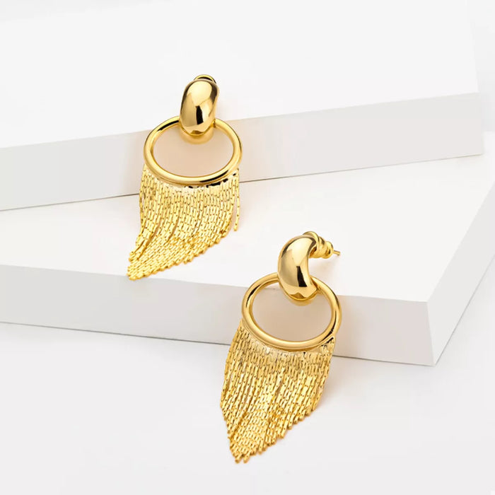 18K Gold Plated Fringe Chain Earrings dangling from a model's ear, showcasing the elegant gold finish and dynamic movement.