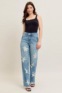 Judy Blue 90s Straight Jeans in a distressed wash, modeled from the front, showing the high waist and straight leg fit.