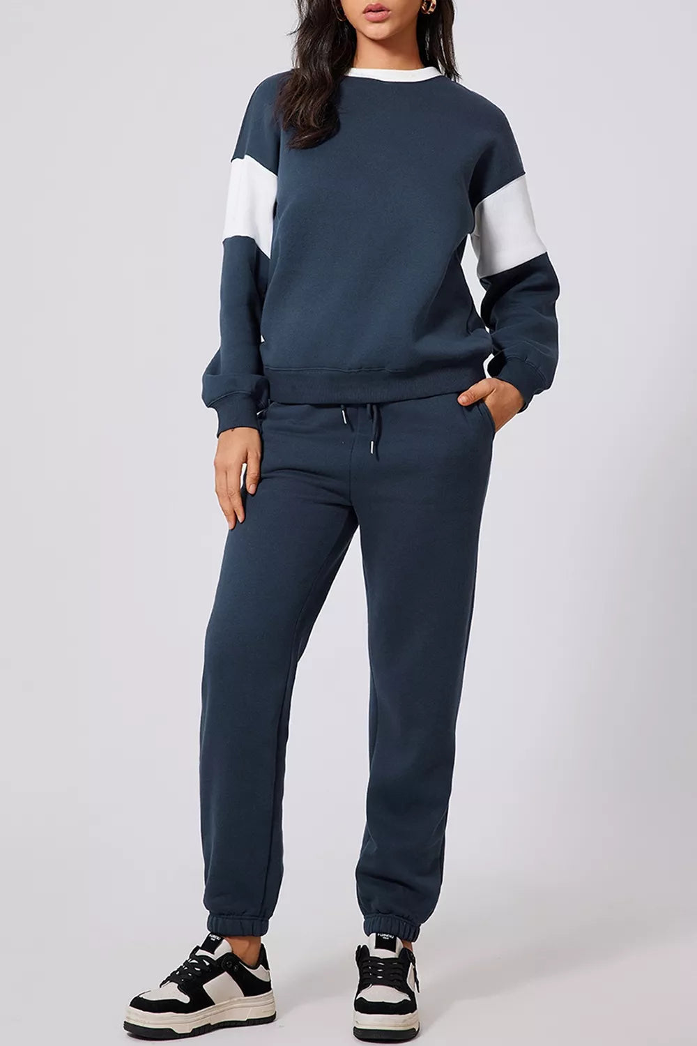 Women's Oversized Loungewear Set in Navy, featuring a drop-shoulder sweatshirt and matching joggers on a model.