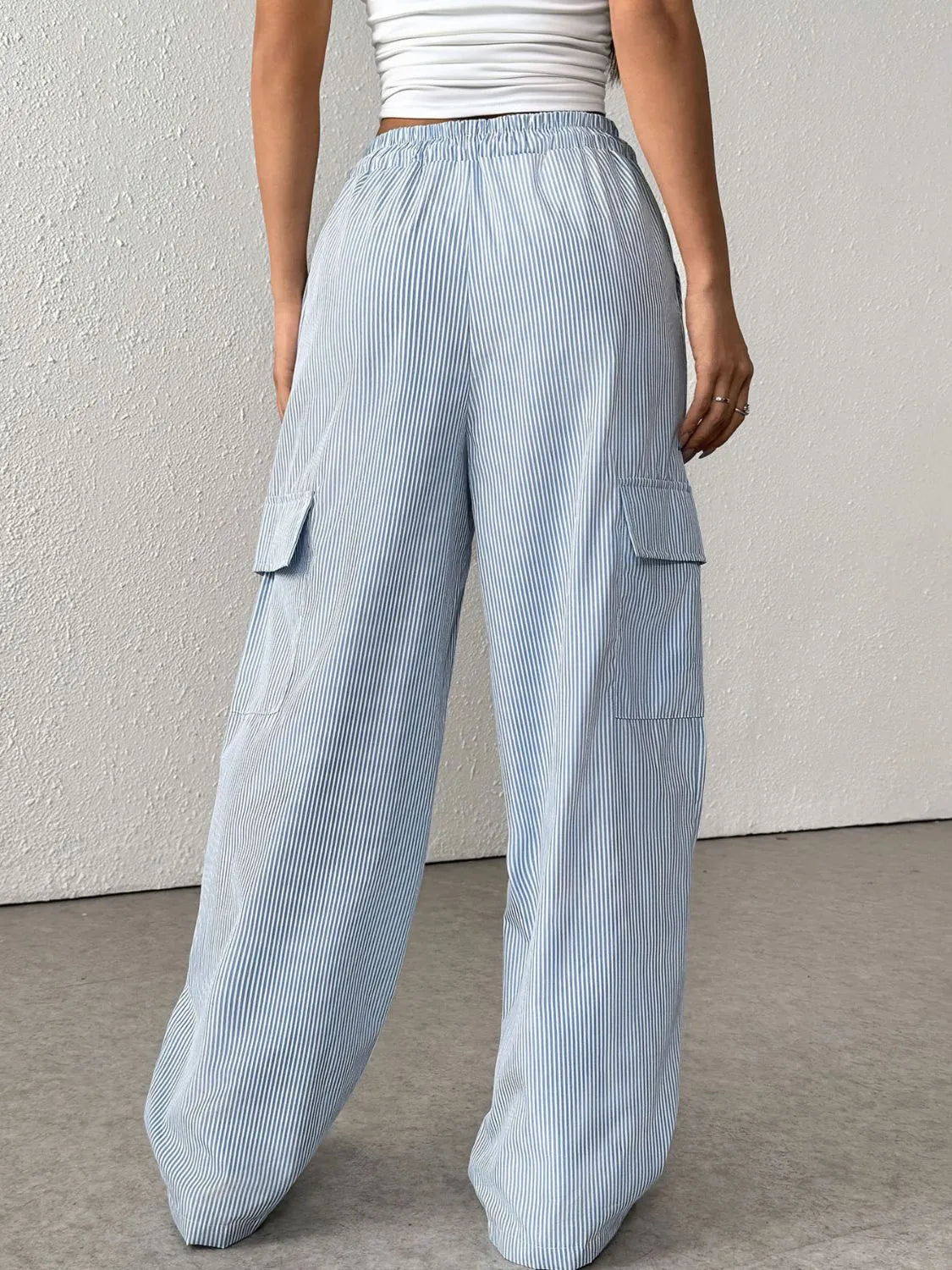 Drawstring Striped Wide Leg Cargo Pants in Light Blue shown on a model, featuring side stripes and large cargo pockets.