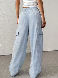 Drawstring Striped Wide Leg Cargo Pants in Light Blue shown on a model, featuring side stripes and large cargo pockets.