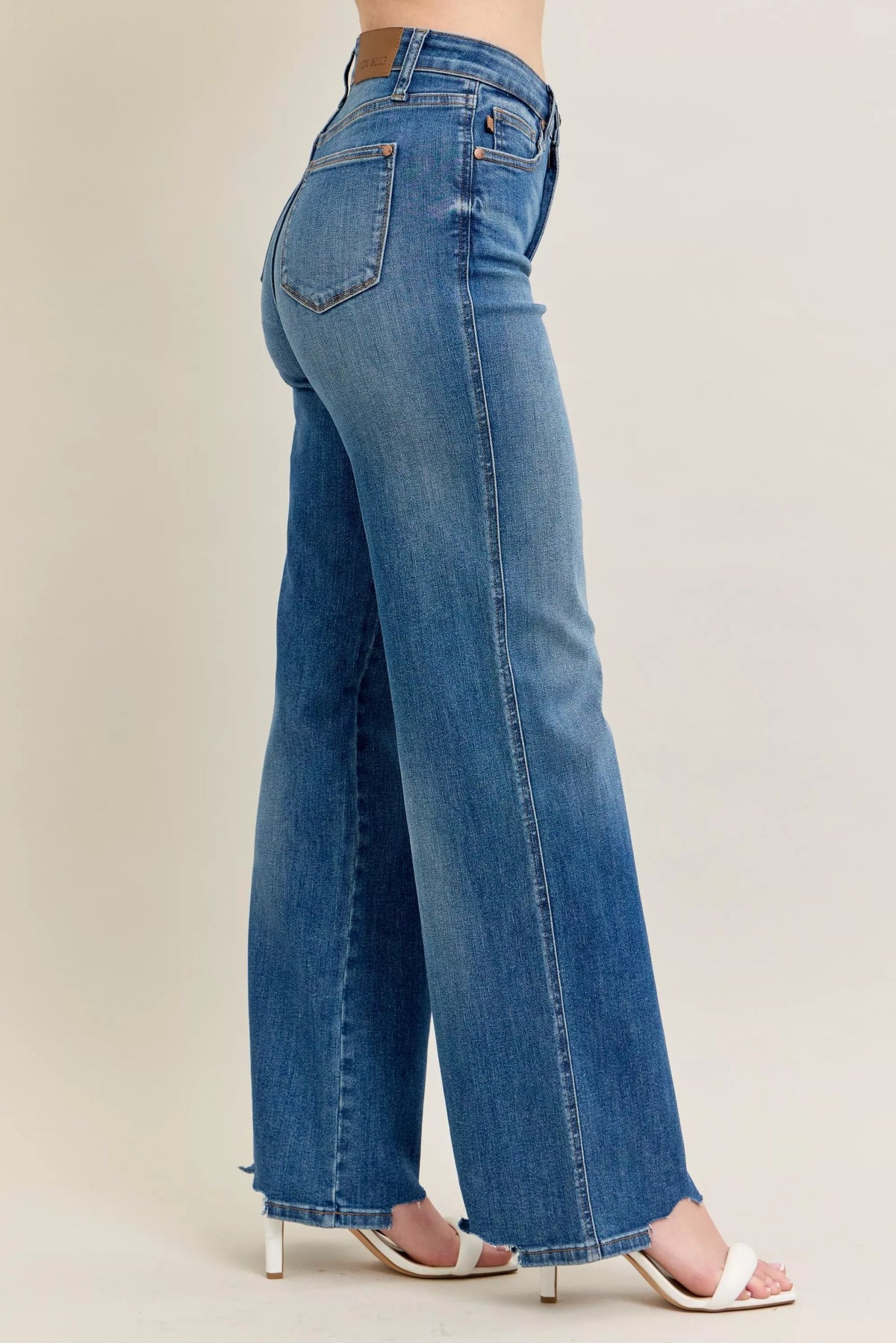 High Waist Tummy Control Jeans with Destroyed Hem on a plus-size model.