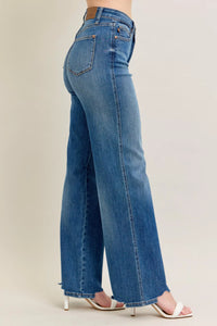 High Waist Tummy Control Jeans with Destroyed Hem on a plus-size model.