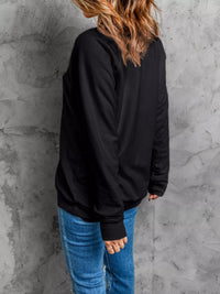 Feeling Spooky Halloween embroidered sweatshirt for women, black crewneck fall fashion.