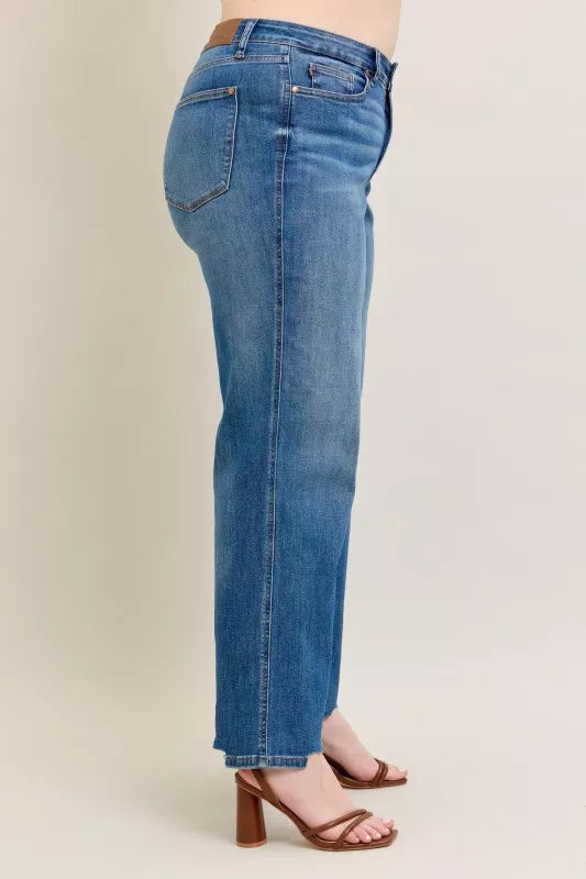 High Waist Tummy Control Jeans with Destroyed Hem on a plus-size model.