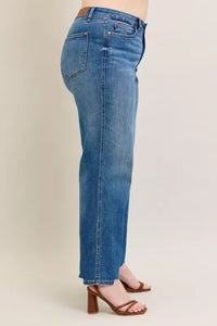 High Waist Tummy Control Jeans with Destroyed Hem on a plus-size model.