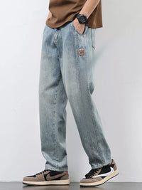 Men's Relaxed Fit Jeans in classic blue wash, comfort stretch fabric for all-day wear