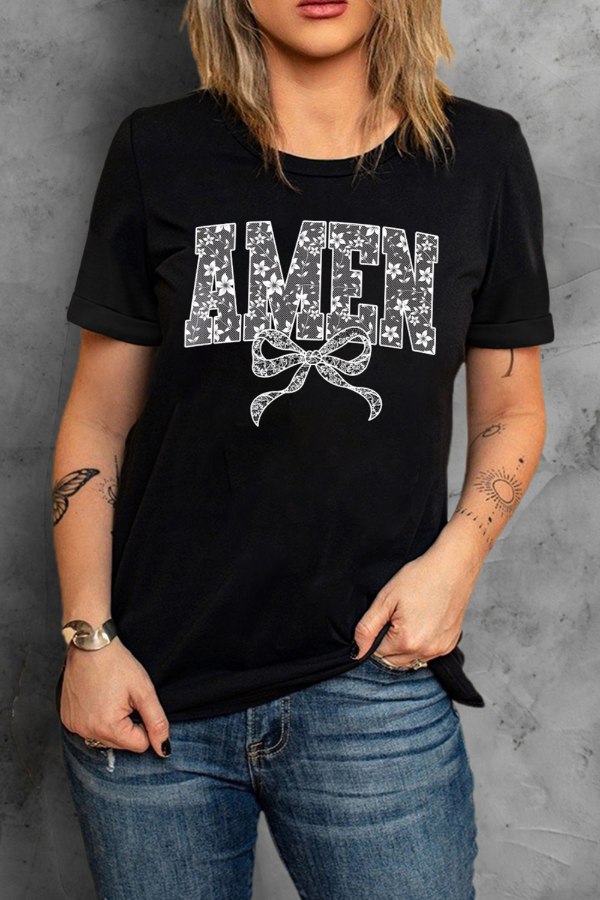 Close-up of the bow detail on the AMEN Round Neck Short Sleeve T-Shirt, showcasing its elegant design.