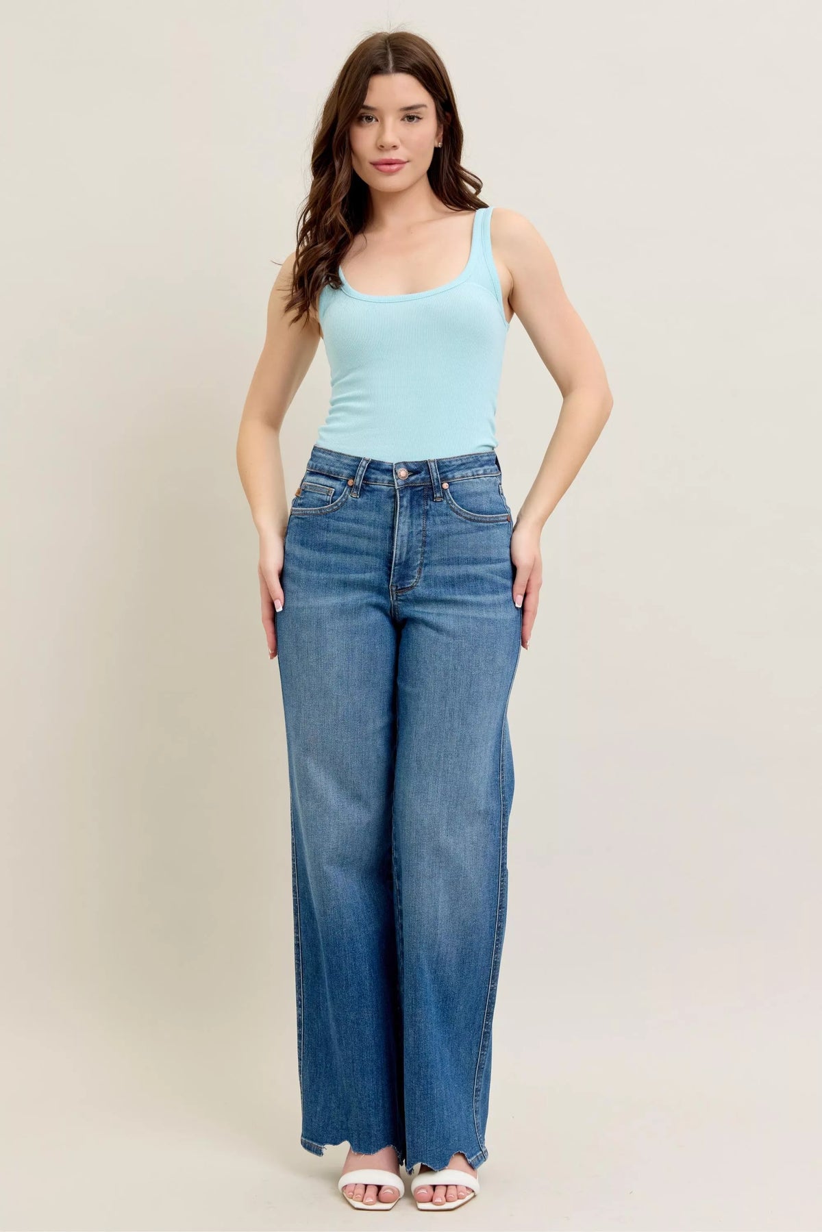 High Waist Tummy Control Jeans with Destroyed Hem on a plus-size model.