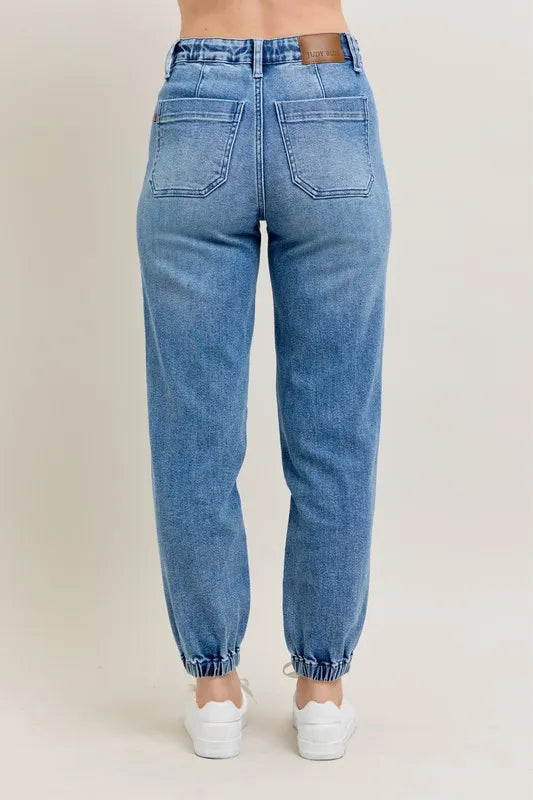 Judy Blue High Waist Denim Jogger in blue wash on model
