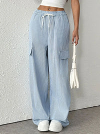 Drawstring Striped Wide Leg Cargo Pants in Light Blue shown on a model, featuring side stripes and large cargo pockets.