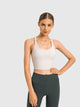 Athletic woman wearing a breathable workout tank top during yoga session