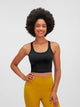 Athletic woman wearing a breathable workout tank top during yoga session