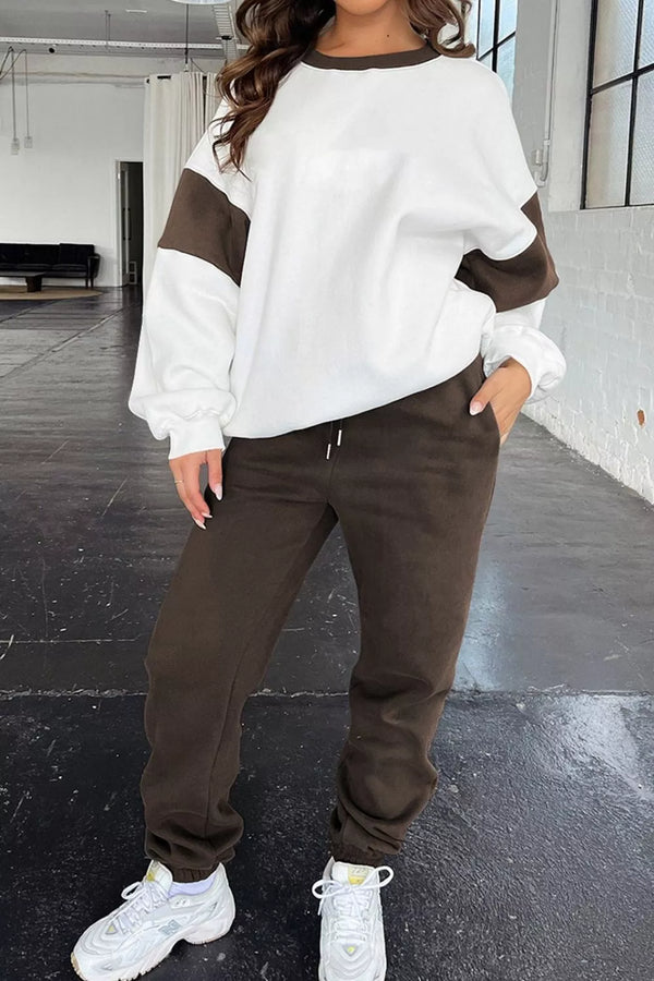 Women's Oversized Loungewear Set in White, featuring a drop-shoulder sweatshirt and matching joggers on a model.