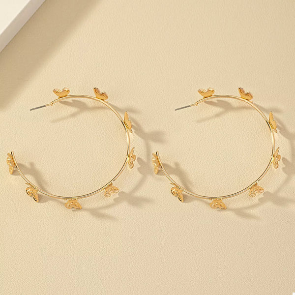 Butterfly Vine Hoop Earrings in 18K gold-plated metal, shown on a woman's ear.