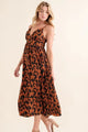 Leopard Print Plunge Maxi Dress on model, showcasing the flattering neckline and long flowy skirt.