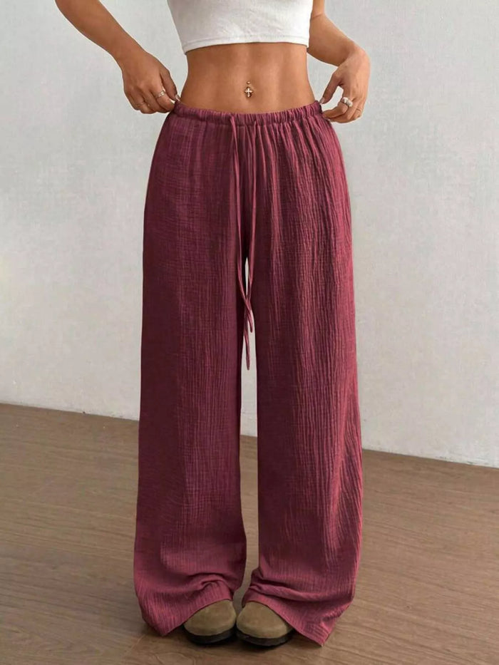 Women's plus size cotton drawstring wide leg pants in Wine Red, showing relaxed fit and tie waist.